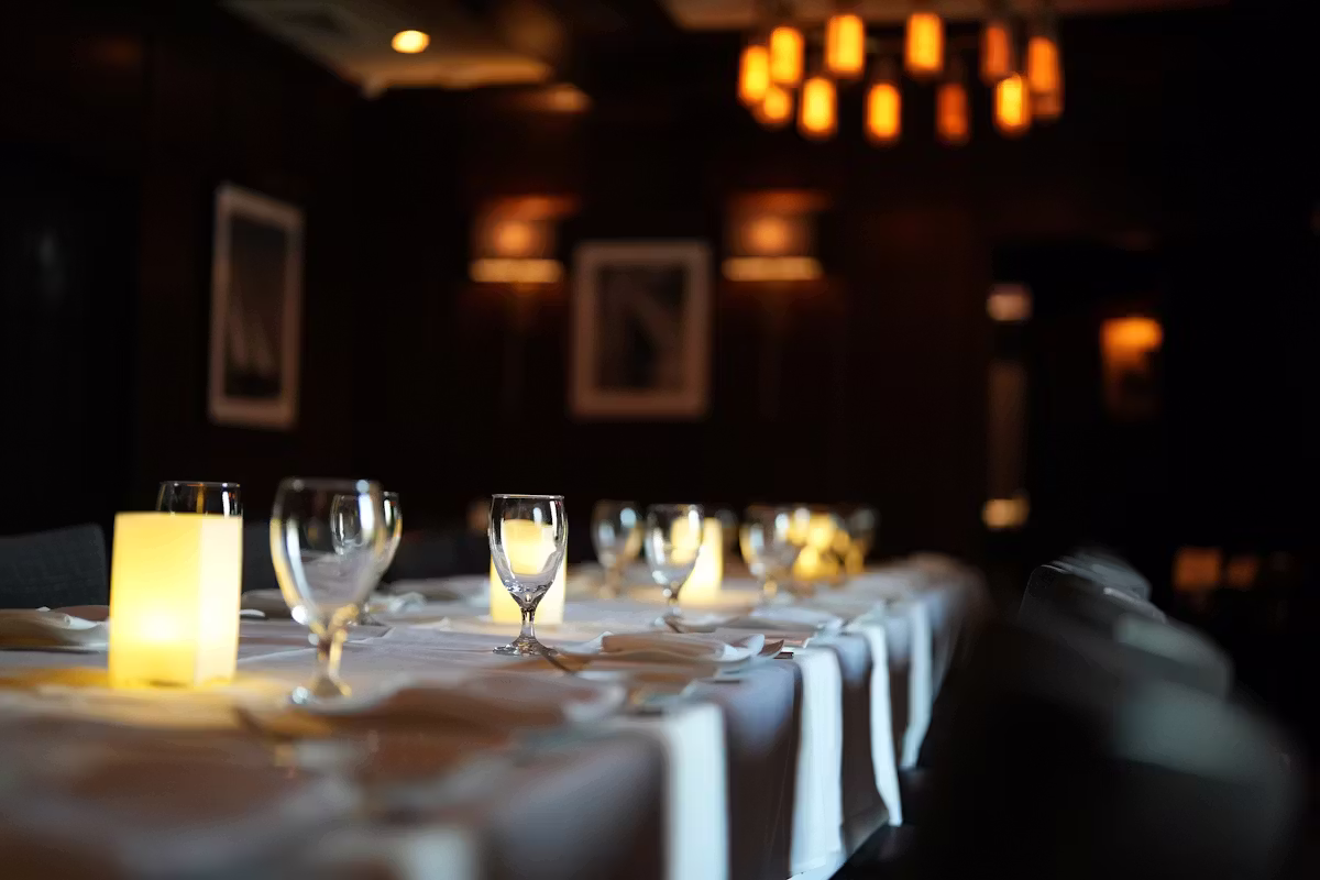 Candlelit private dining room set for a celebration dinner at Oceanos Oyster Bar & Sea Grill
